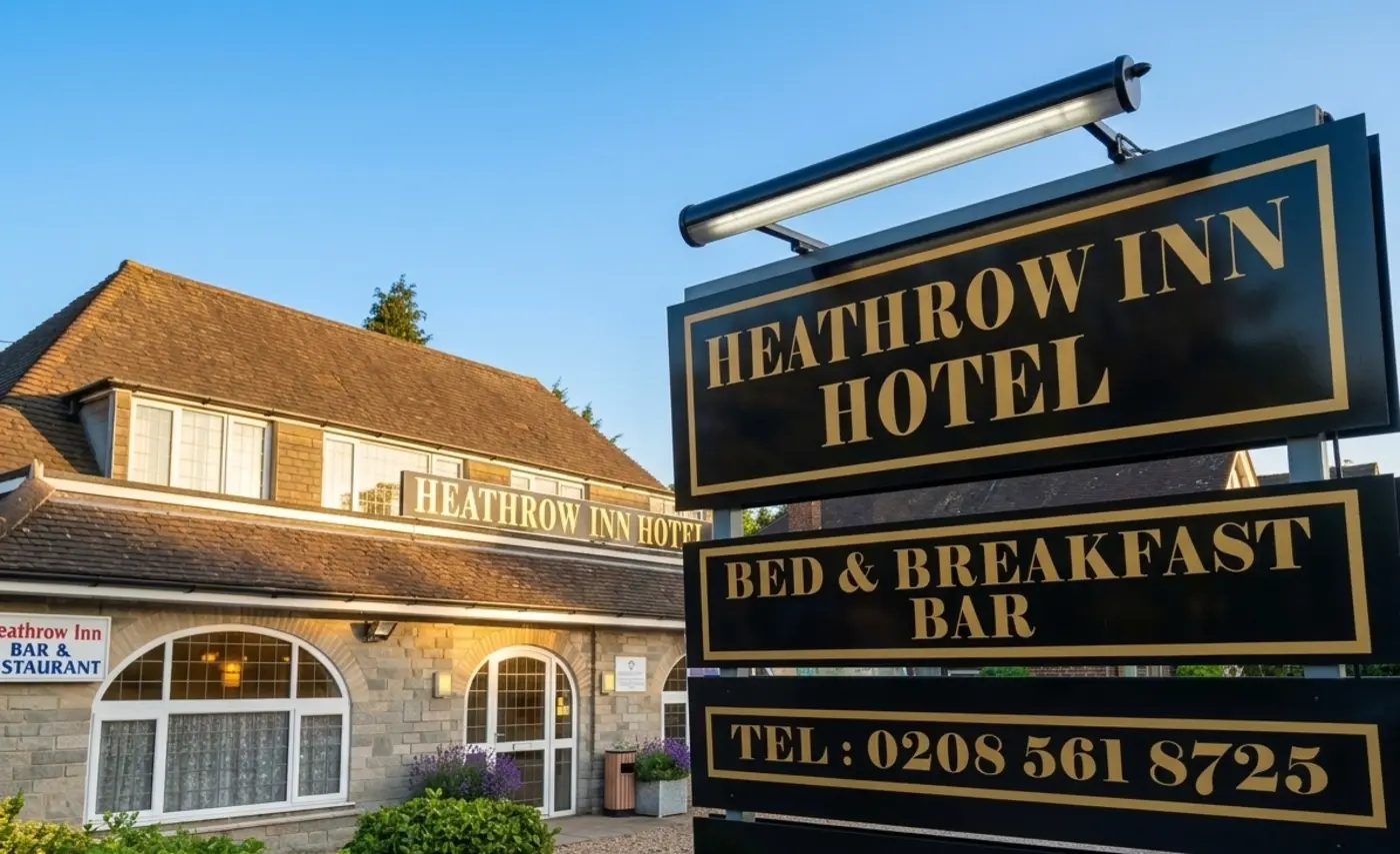 Heathrow Inn Hotel signage with bed and breakfast bar and phone number